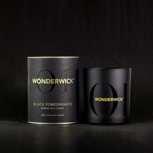 The Country Candle Company Wonderwick Black Pomegranate scented candle with a wooden wick to create a relaxing real fire crackle