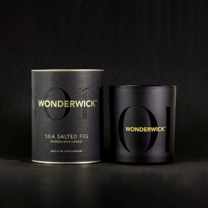 The Cotswold Candle Company Wonderwick sea-salted fig scented candle with a wooden wick to create a relaxing real fire crackle
