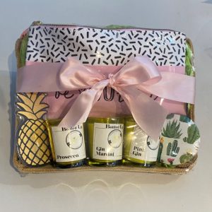 beYOUtiful cocktail candle gift set. Jute storage tray with a make up pouch with decorative text BeYOUtiful, a cactus compact handbag mirror, pineapple nail file and 3 prosecco cocktail themed candles