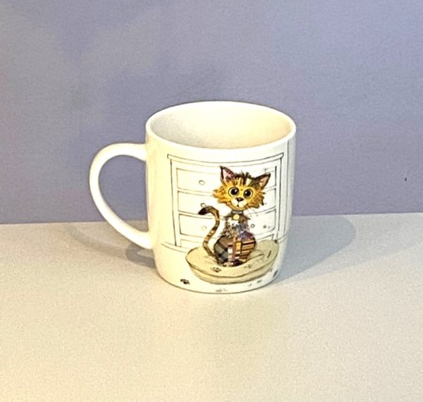 Classic white mug with a cute wide eyed kitten with a colourful collage decoration. Quirky Kimba Kitten Bug Art mug