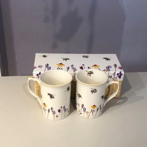 pair of fine chine mugs in a wild flower and bee design in a matching luxury gift box