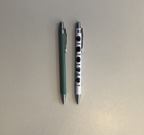 A set of two ball point pens in a guitar design