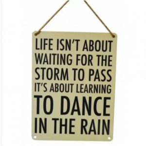 Learning to dance in the rain inspirational metal sign