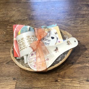 New home gift basket- planter, tea towel, spoon rest and coaster