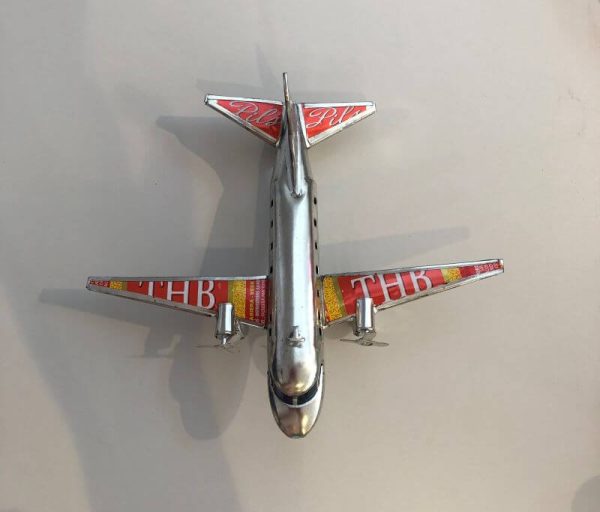 airplane hand made from recycled drink cans
