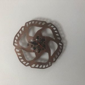Quirky clock handmade from a recycled brake disc.