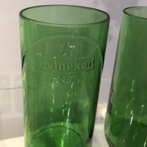 Two hi ball glasses formed from Heineken beer bottles.