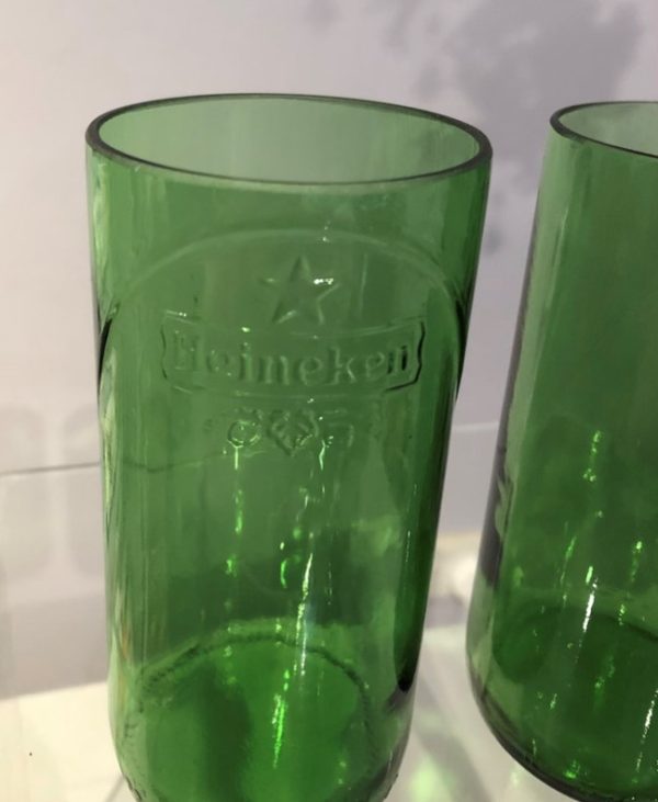 Two hi ball glasses formed from Heineken beer bottles.