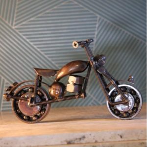 copper motorbike made from recycled metal and parts