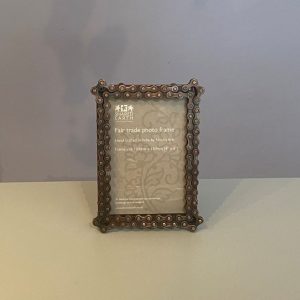 Photo frame made from recycled metal and bike chains. Holds 4" by 6" photo