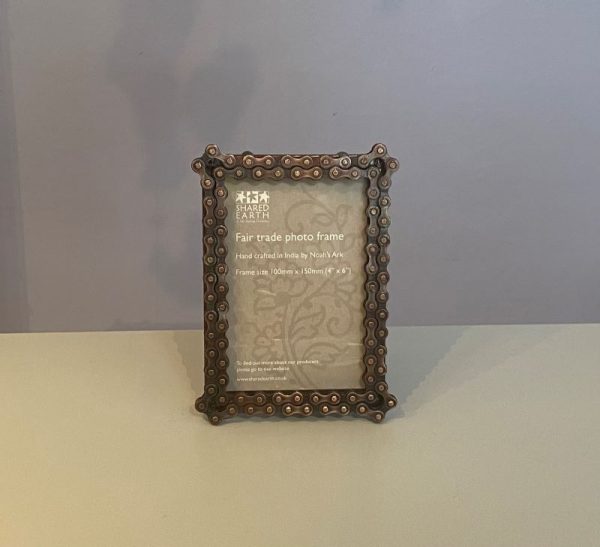 Photo frame made from recycled metal and bike chains. Holds 4" by 6" photo