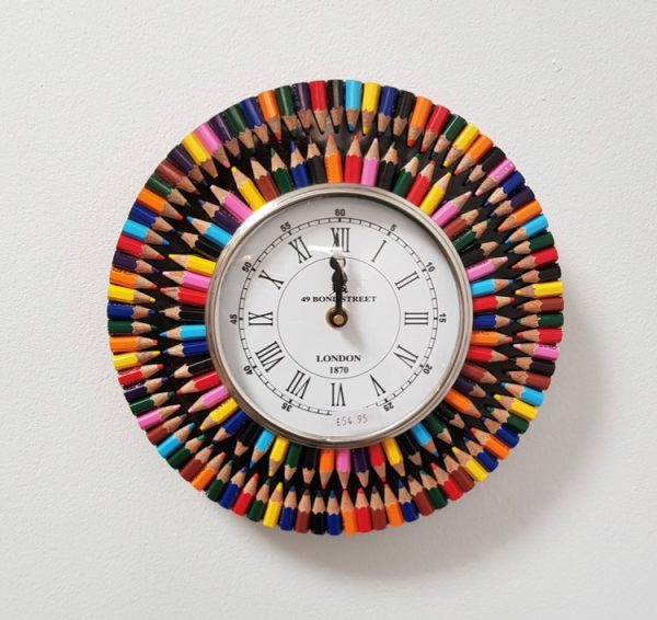 clock hand decorated with recycled pencil stubs
