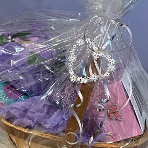 flower trug gift basket perfect for Mother's day with a soap flower bouquet, stemless wine glass and real flower reed diffuser