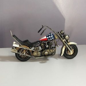 Highly detailed replica of a vintage Harley Davidson motorbike.