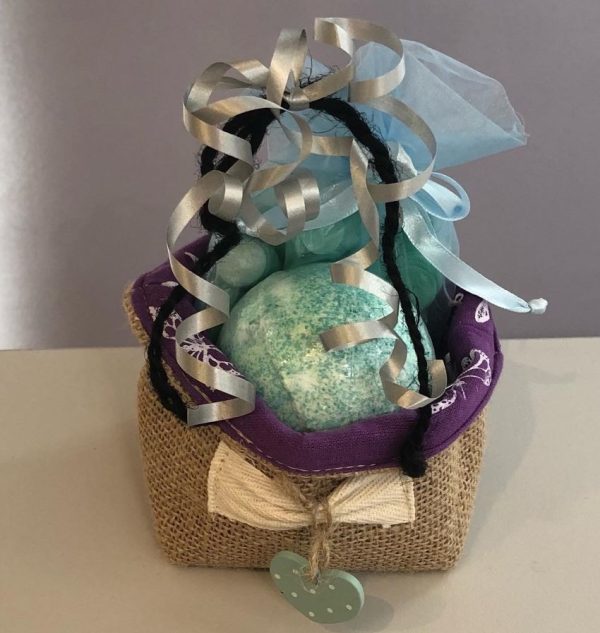 gift basket with bath bomb and bath confetti