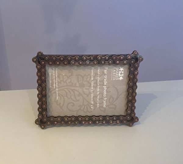 Photo frame made from recycled metal and bike chains. Holds 4" by 6" photo landscape or portrait