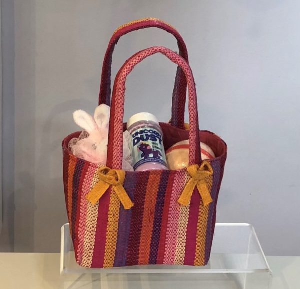 raffia bag filled with children's bath treats