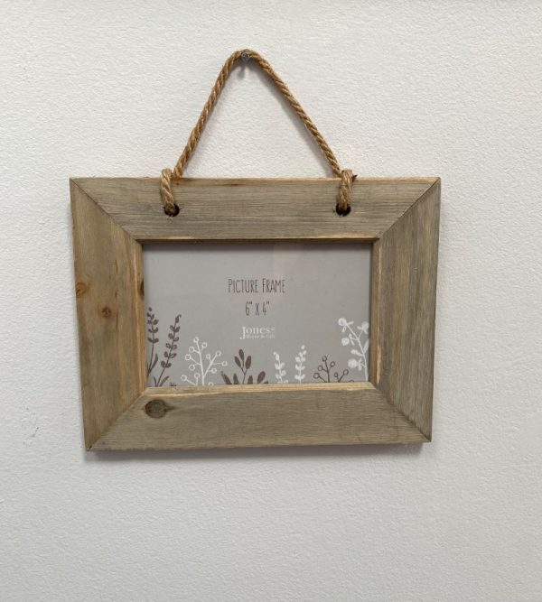 rustic driftwood wall mounted photo frame with a rope hanger.