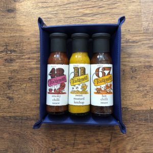 genlemans storage tray with 3 Tracklements artisan sauces