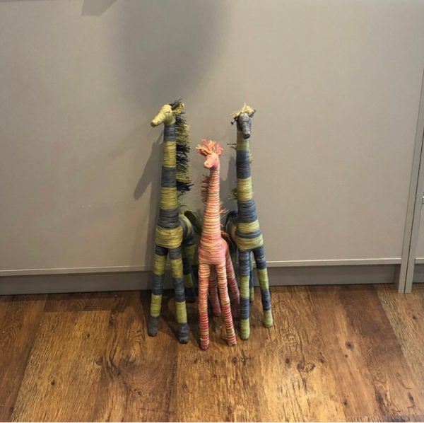colourful standing giraffes hand crafted from natural raffia