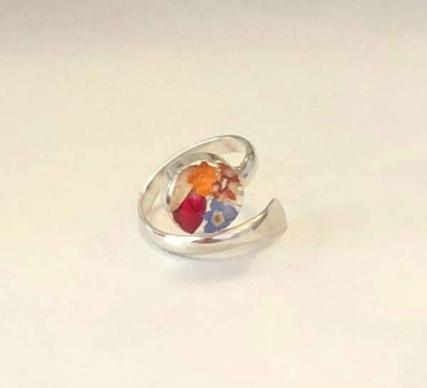 silver ring with real flowers encased in resin
