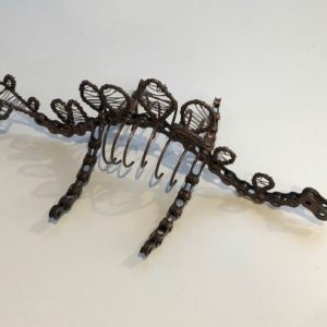 dinosaur ornament made from recycled bike chains and scrap metal