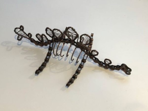 dinosaur ornament made from recycled bike chains and scrap metal