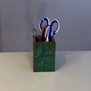 wooden pen pot decorated with recycled computer circuit boards