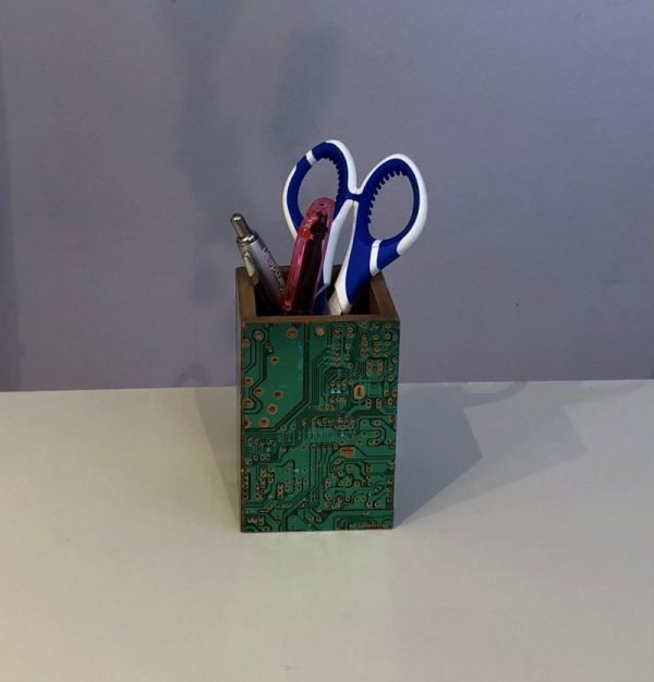 wooden pen pot decorated with recycled computer circuit boards