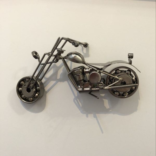 motorcycle ornament sculpted from scrap metal and recycled nuts and bolts