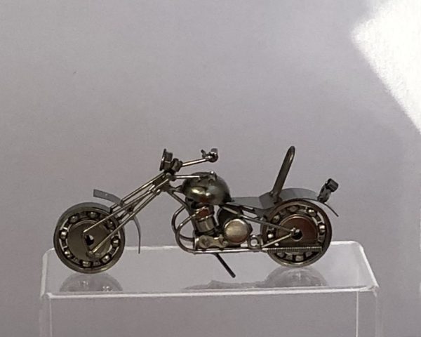 silver metal motorcycle mad from recycled nuts, bolts and scrap metal