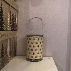 glass lantern with a craft snowflake decoration