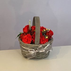 beautiful flowers hand crafted from soap in a grey trug wicker basket