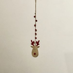 wooden reindeer on a rustic string hanger with red sleigh bells
