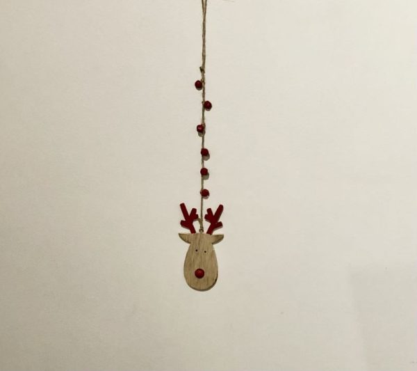wooden reindeer on a rustic string hanger with red sleigh bells