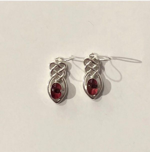 unusual sterling silver Celtic knot earrings with a real poppy encased in resin