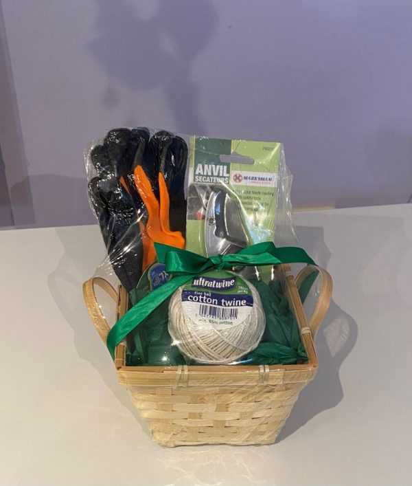 Gardening gift set. Wicker planter filled with gardening gloves, secateurs and a ball of string