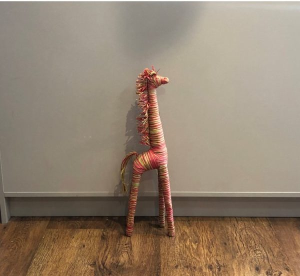 large standing giraffe hand crafted from natural raffia