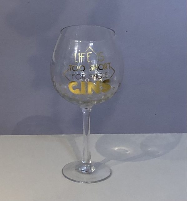 gin glass with decorative gold script life is too short for single gins