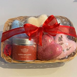 Valentine's Day gift basket with floral scented candle, luxury heart shaped bath bombs and soap roses