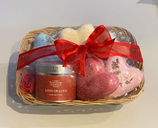 Valentine's Day gift basket with floral scented candle, luxury heart shaped bath bombs and soap roses