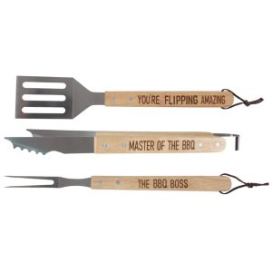 Novelty BBQ utensils gift set. Box includes 3 wooden handled barbecue tools with humorous inscriptions. A spatula with You're flipping amazing on the handle, a fork with The BBQ boss and a pair of tongs saying Master of the BBQ ,