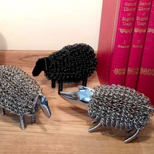 Black sheep wiggle animal. A quirky metal sheep sculpture made with coiled nickle plated wire with a black finish