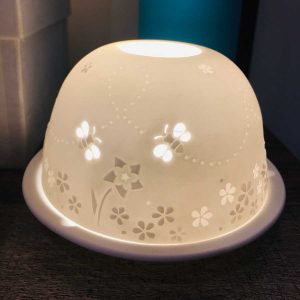 Busy bee dome tea light candle holder. Porcelain dome with etched flower and bee design which comes alive when lit from within the dome and the light shines through.