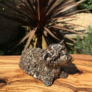 Baby highland calf sitting and resting bronze statue by Frith