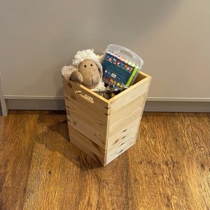 Tall storage crate handmade from recycled wood with carry handles making it perfect as a toy box or log or kindling box