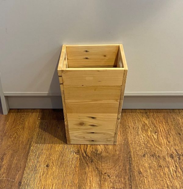 Tall natural wood storage box with handles handcrafted from recycled wood.