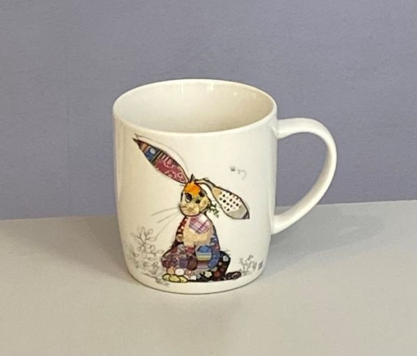Classic white mug with a cute floppy eared rabbit with a colourful collage decoration. Quirky Binky Bunny Bug Art mug
