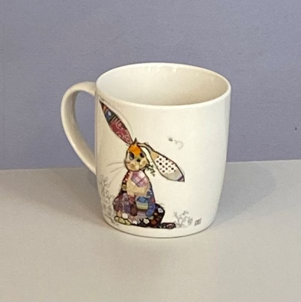 Classic white mug with a cute floppy eared rabbit with a colourful collage decoration. Quirky Binky Bunny Bug Art mug